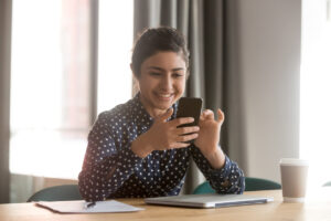 Indian using mobile during meetings