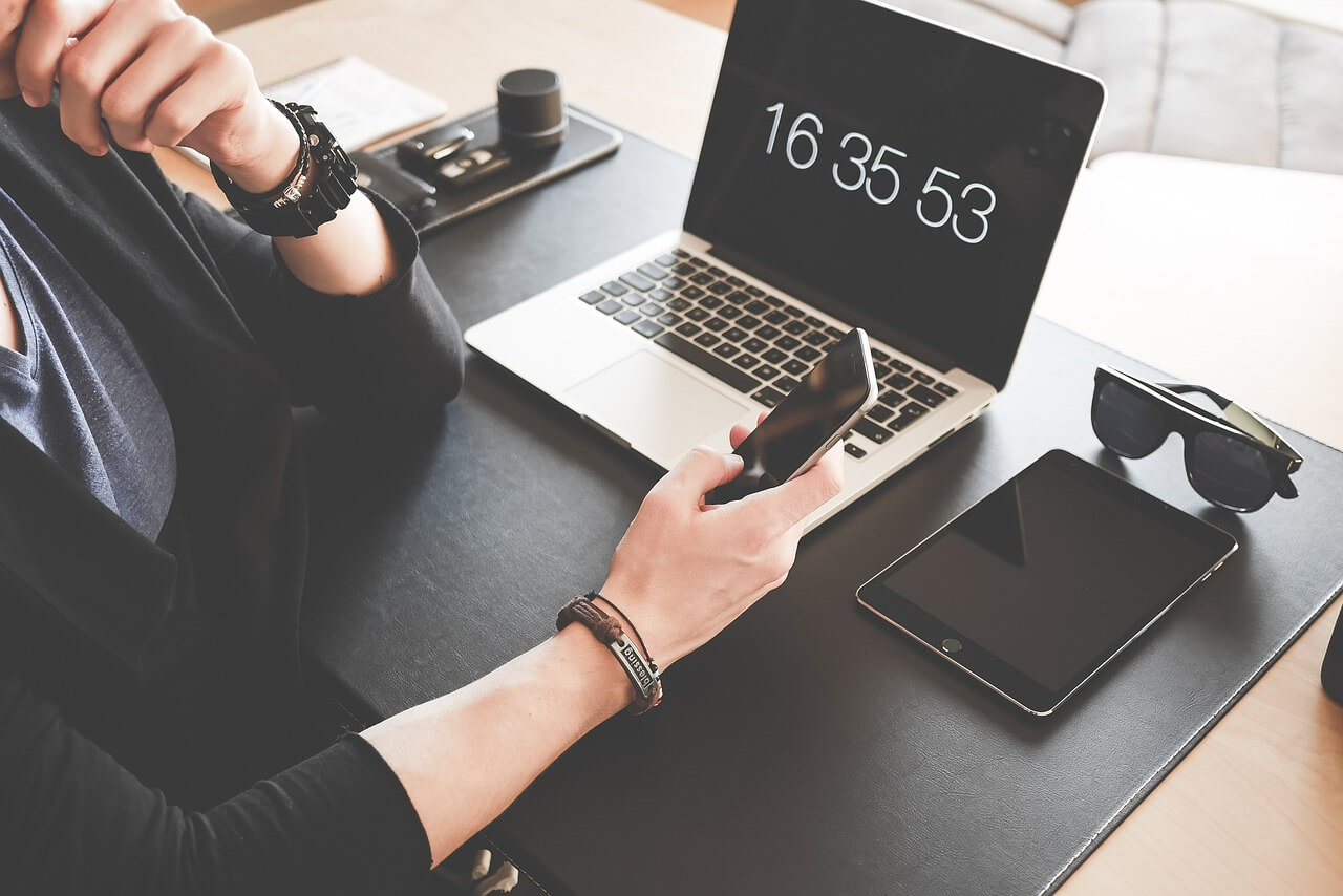 person checking the time at the end of the working day